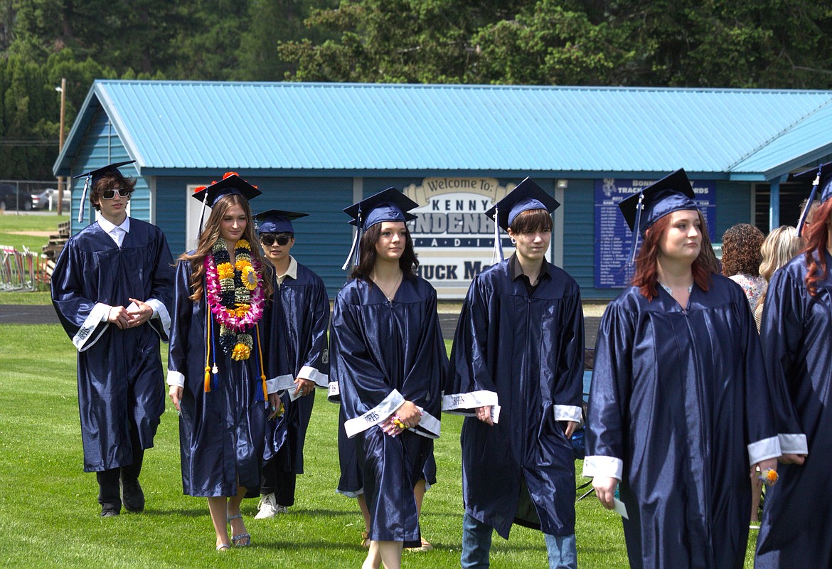 Graduates walk into ceremony.