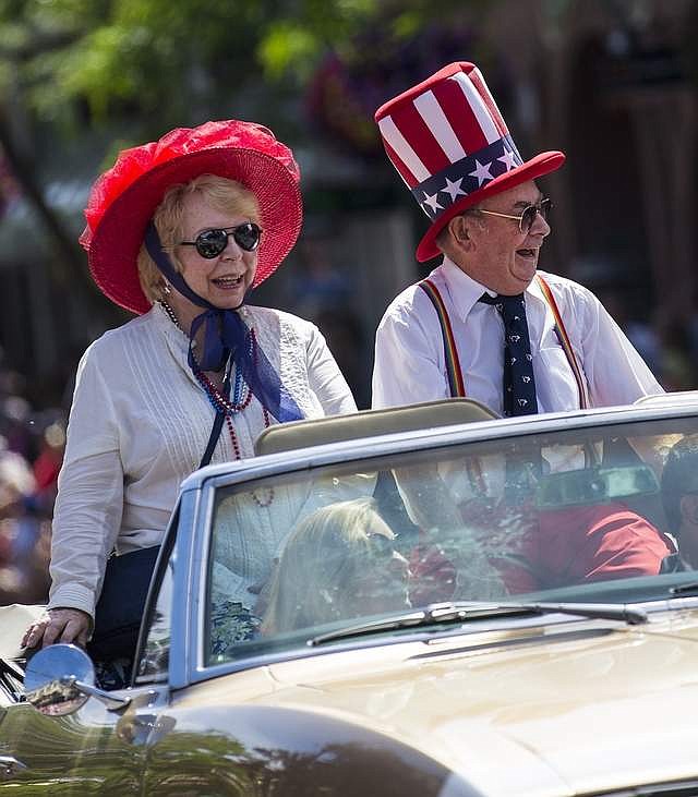 Larry and Sharon Strobel ride in front of the Perfection-Nots during the 2017 Fourth of July Parade.