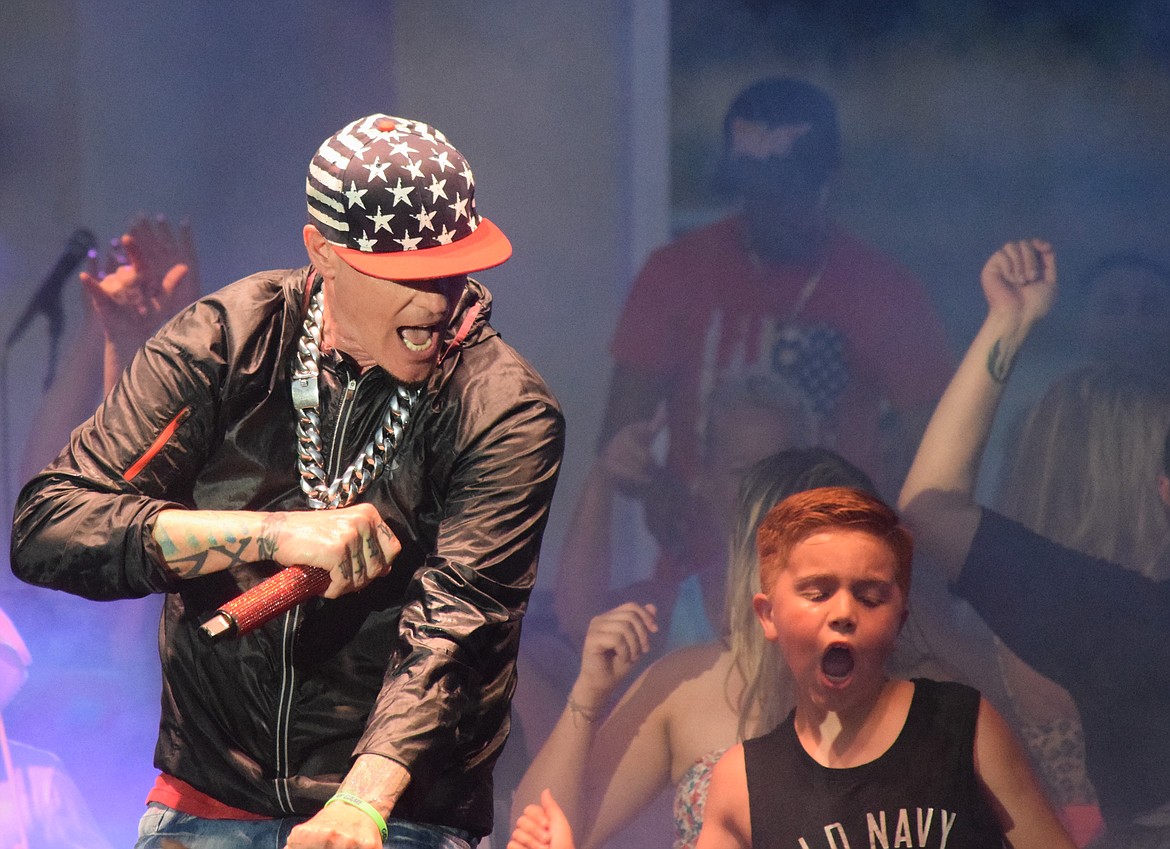 Max House, right in the Old Navy tank top, gets into the show at Vanilla Ice’s, left, show on May 28 at the Moses Lake Spring Festival.