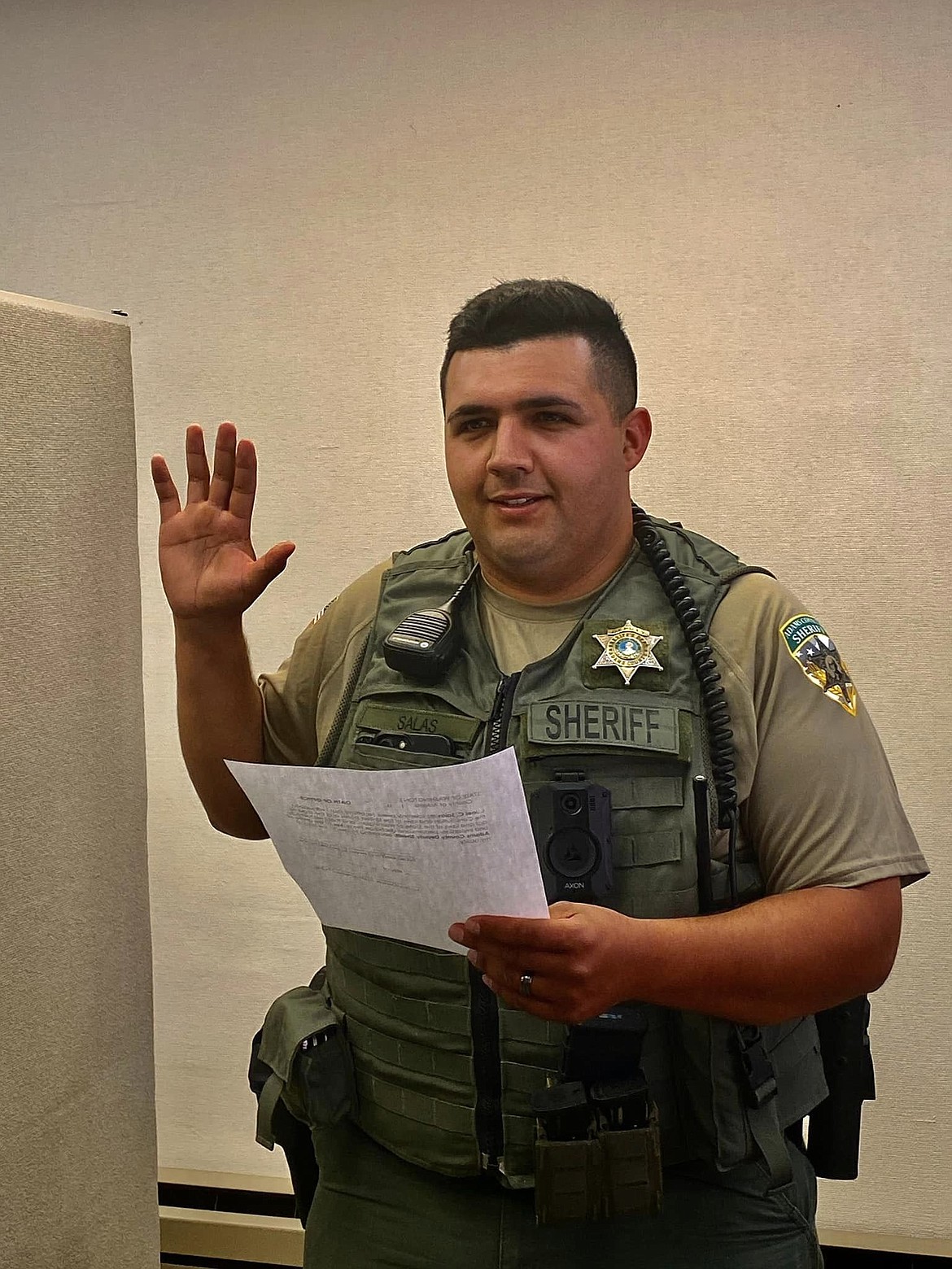 deputy Joel C. Salas is sworn in as a road deputy with the Adams County Sheriff's Office.