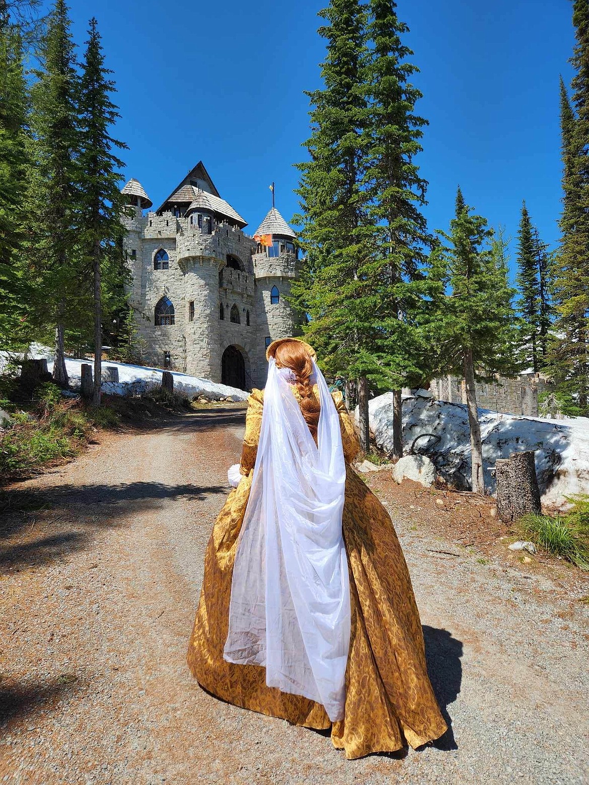 Tanya Anderson, dressed as Queen Elizabeth I, is pictured at a Sagle castle. This weekend, Anderson and the rest of the Sandpoint Renaissance Faire will transport the community back into to the 1500s and the rule of Queen Elizabeth I.