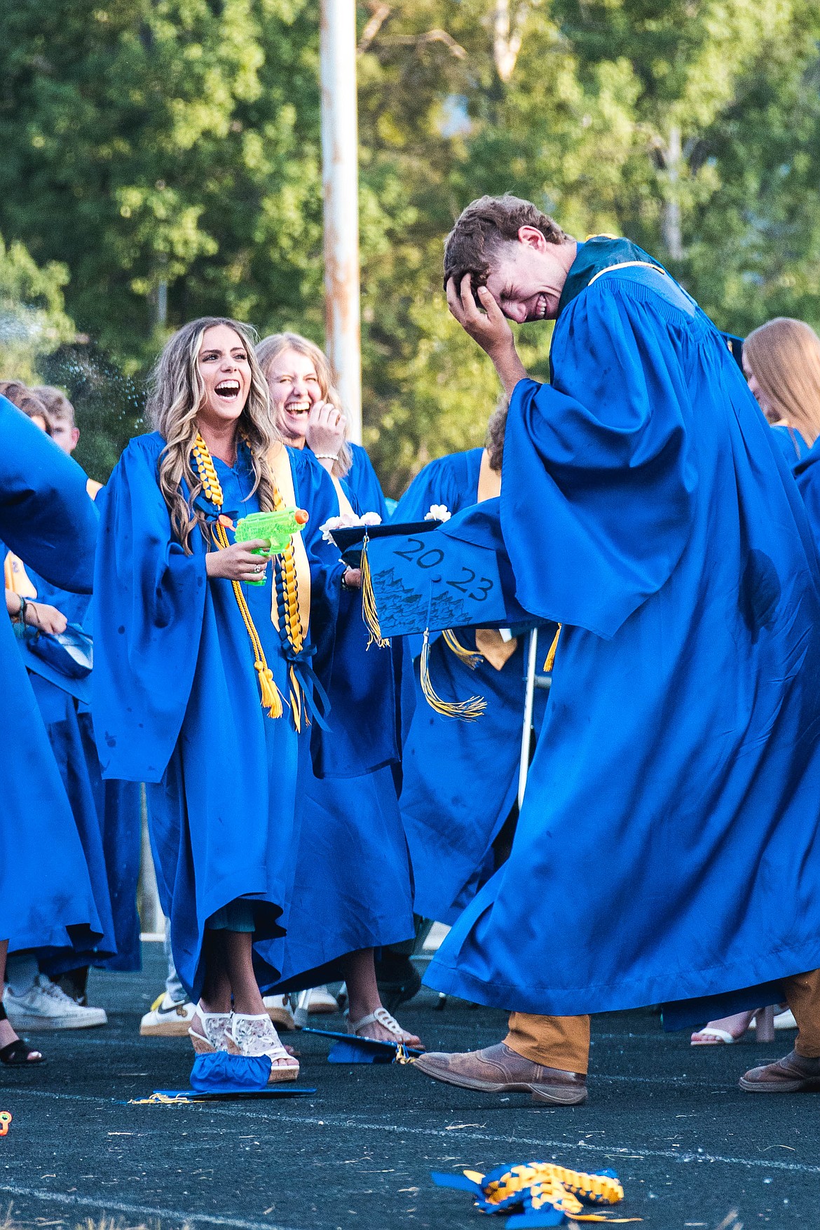 Grads pulled squirt guns from under their robes after throwing their caps in the air.