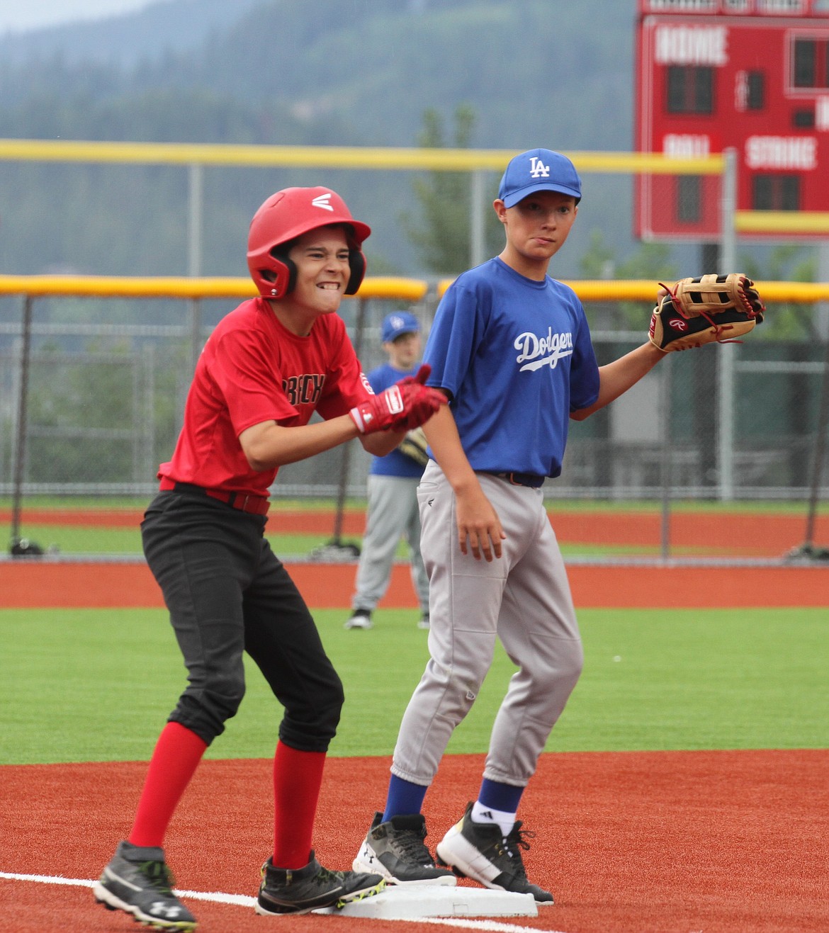 Mac Peters celebrates after hitting a triple in the first inning of the Majors championship.