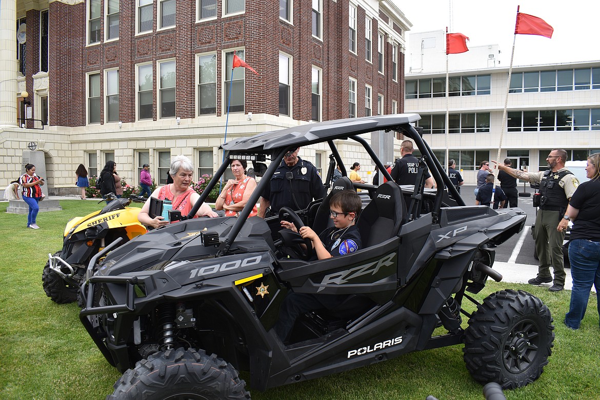 Ephrata Police Chief-for-a-Day Koen Hays checks out a dune buggy belonging to the Grant County Sheriff’s Office.