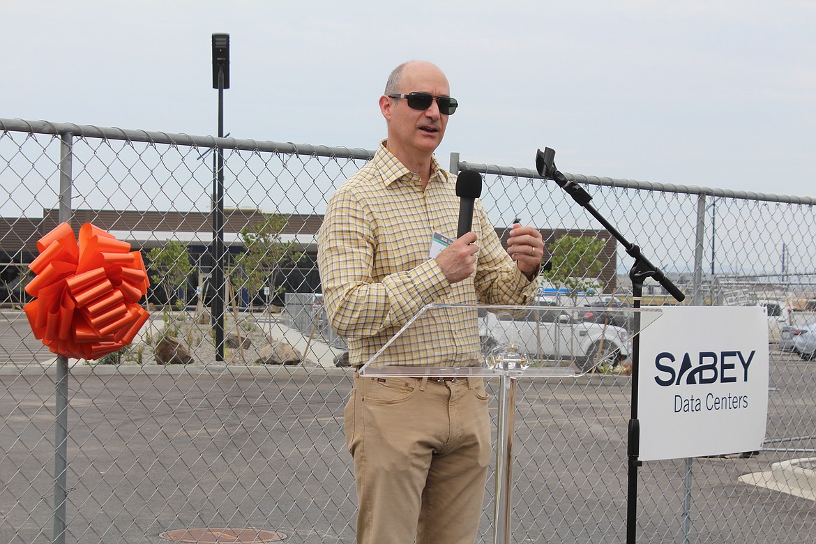 Sabey Data Centers Executive Director John Sabey talks to the crowd prior to a ceremony commemorating the company’s expansion.