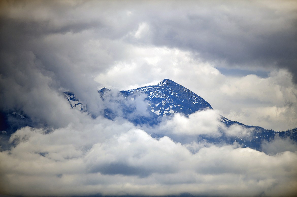 Low clouds frame a view of Mount Aeneas on Wednesday, May 24. (Casey Kreider/Daily Inter Lake)