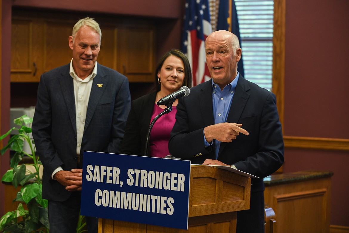 Gov. Greg Gianforte speaks at a bill signing ceremony at the Flathead County Courthouse on June 9, 2023. State Rep. Courtenay Sprunger, R-Kalispell, who sponsored both bills that Gianforte signed, is seen behind the governor with U.S. Congressman Ryan Zinke next to her. (Kate Heston/Daily Inter Lake)