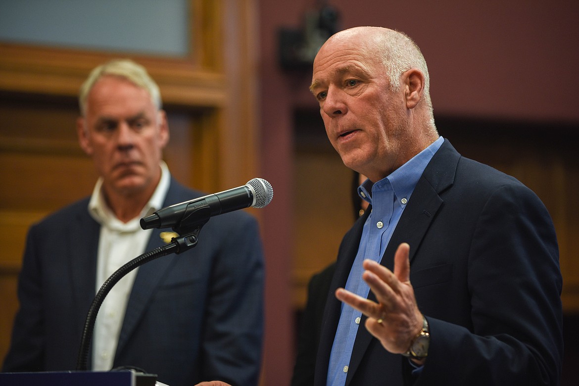 Gov. Greg Gianforte speaks at a bill signing ceremony at the Flathead County Courthouse on June 9, 2023. Congressman Ryan Zinke is seen behind him. (Kate Heston/Daily Inter Lake)