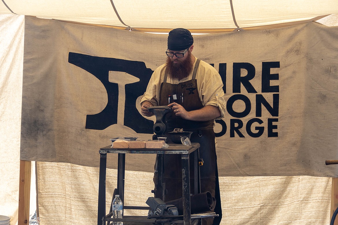 A metal worker is pictured at the Sandpoint Renaissance Faire on Saturday.
