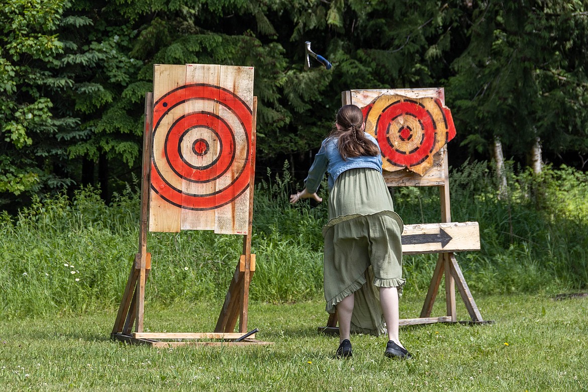 A Sandpoint Renaissance Faire participant tries her hand at axe throwing on Saturday.
