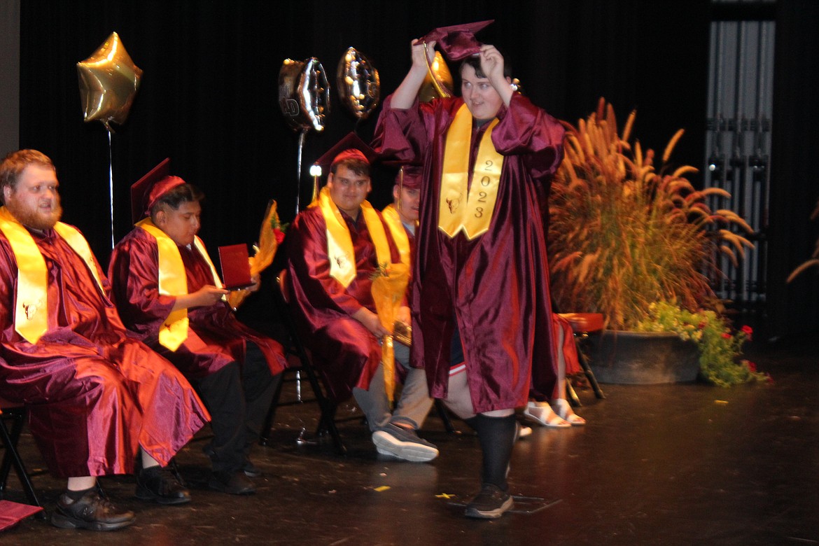 Adam Carpenter takes the walk to pick up his diploma at the Moses Lake PALS graduation ceremony June 7.