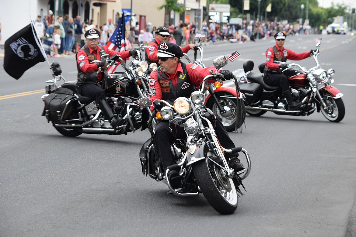 Members of the Tenino Motorcycle Drill Team maneuver in the middle of Basin Street at the start of this year’s Grand Parade on Saturday, part of the annual Sage-N-Sun festival in Ephrata.