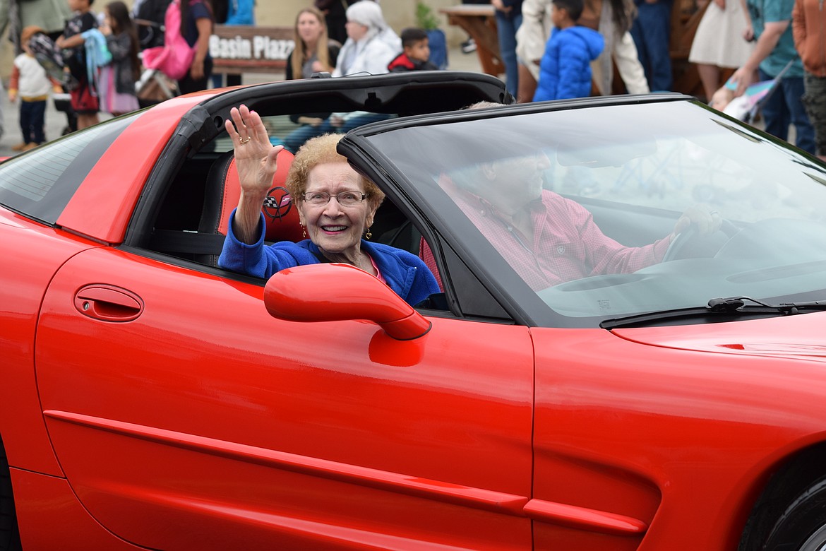 Grand Marshal Grace Nelson, who graduated from Ephrata High School in 1951, waves to the crowd during the Sage-N-Sun Grand Parade on Saturday.