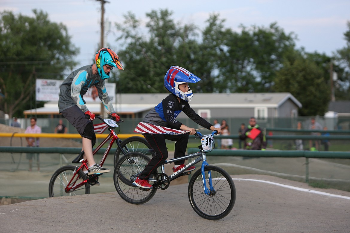 The race began with riders carrying small American flags down the course of the Larson BMX Track with the Star-Spangled Banner playing.