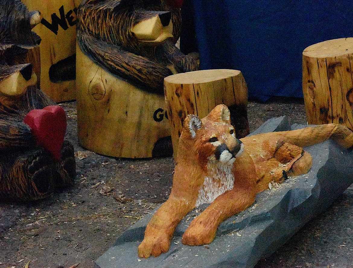 Each carver at the Chainsaw Carvers Rendezvous in Ronan made one large carving for the Sunday auction and two everyday "quick carves," like this mountain lion. (Berl Tiskus/Leader)