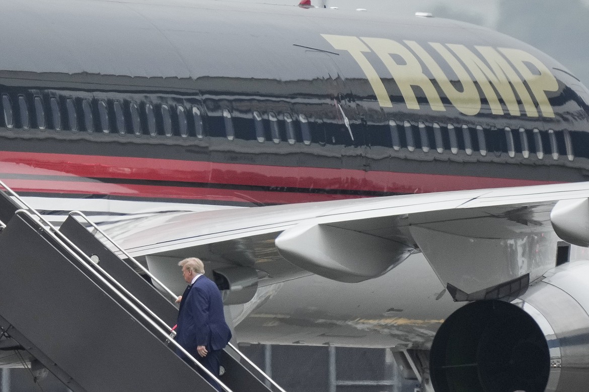 Former President Donald Trump boards his airplane at Newark Liberty International Airport, Monday, June 12, 2013 in Newark, N.J. Trump will fly to Florida where he will face criminal charges pertaining to mishandling of classified documents. (AP Photo/Bryan Woolston)