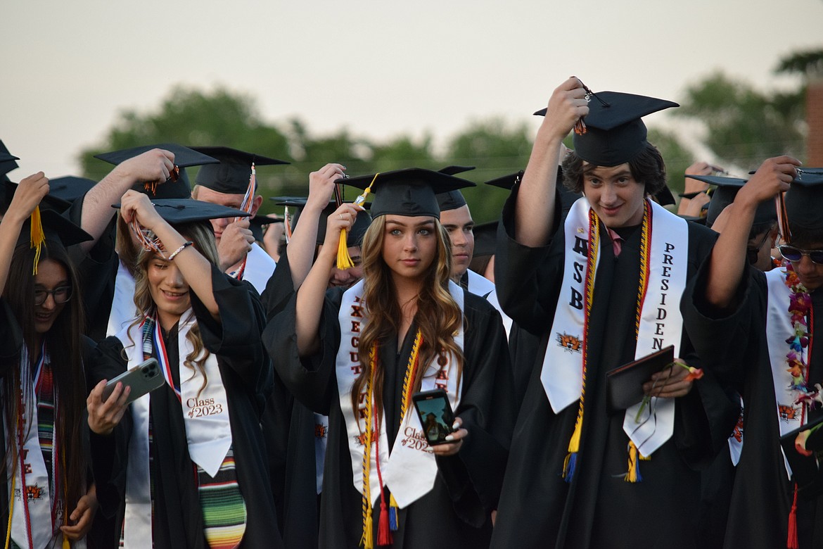 Ephrata High School seniors turn their tassels as Superintendent Tim Payne proclaims them official high school graduates at the school’s graduation ceremony June 2.