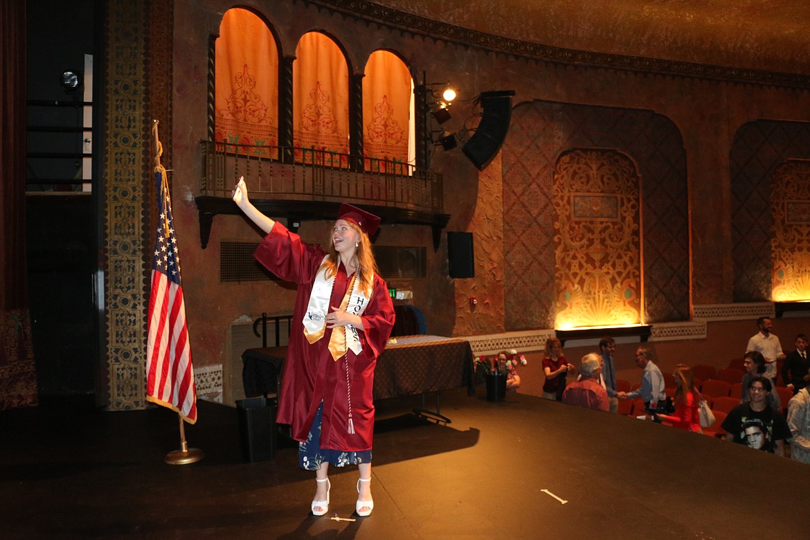 A Forrest Bird Charter School graduate takes a selfie from the Panida stage after receiving her diploma during Saturday's graduation.