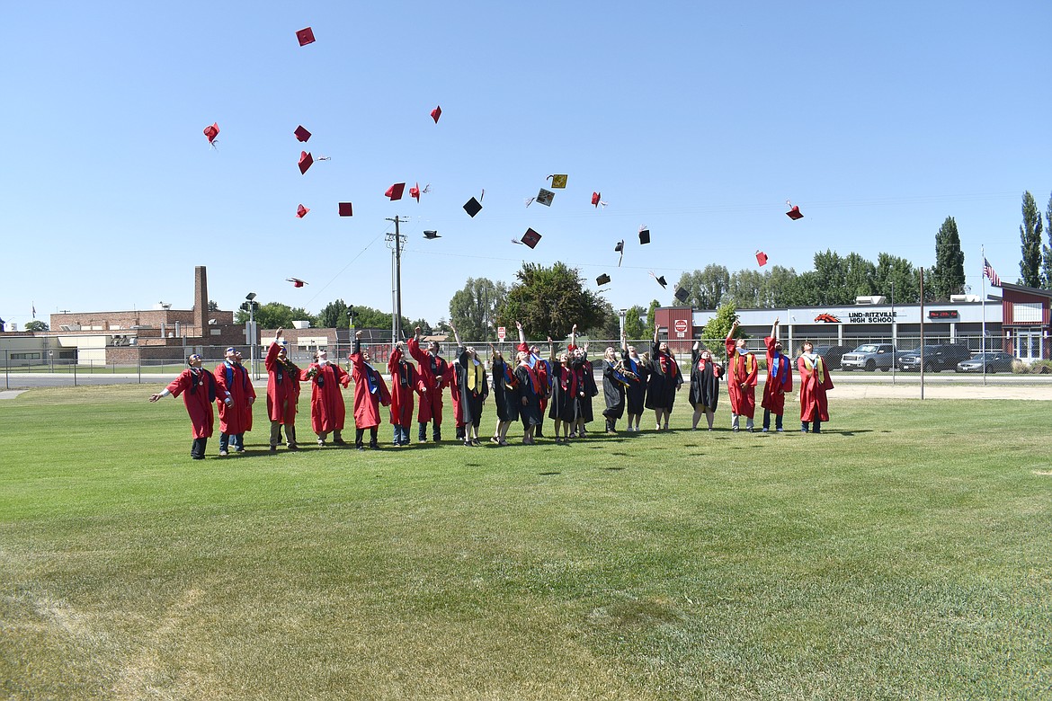 Jubilant members of the Lind-Ritzville Class of 2023 fling their caps in the air following graduation June 3.