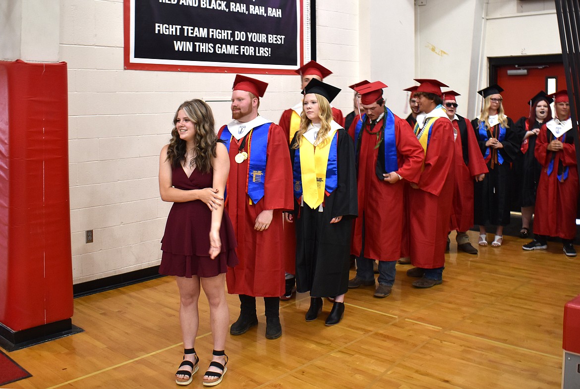 Lind-Ritzville seniors, led by LRHS junior Megan Melcher, wait to process into the Gilson Gym for their commencement ceremony June 3.