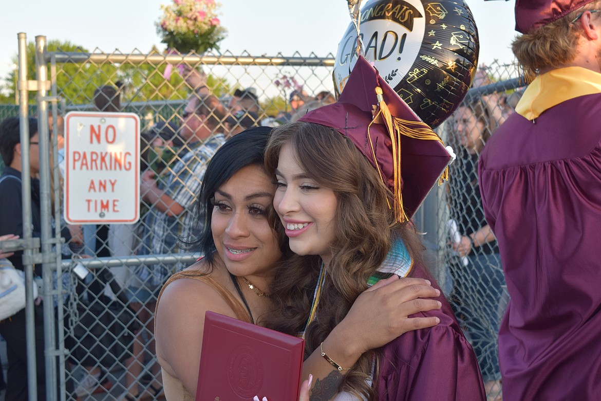 Lisett Mendoza-Rodriguez gets a hug from her mom, Margarita Rodriguez, after the graduation ceremony on June 2. Mendoza-Rodriguez said she wants to study psychology and help people as a counselor. Her mother said she was extremely proud of her daughter for her accomplishments.