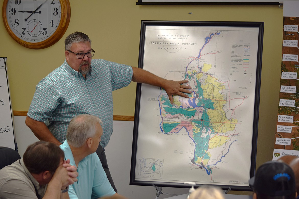 East Columbia Basin Irrigation District Secretary-Manager Craig Simpson outlines how the Columbia Basin Project works during a meeting Monday morning with NRCS Chief Terry Cosby at the Washington State Potato Commission offices in Moses Lake.