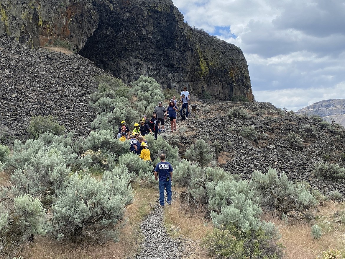 First responders bring out a patient who suffered a medical incident at the Lake Lenore Caves Sunday.