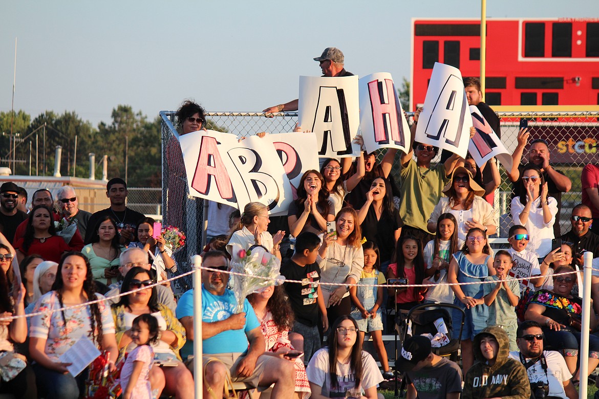 Family members show their support for an Othello graduate.