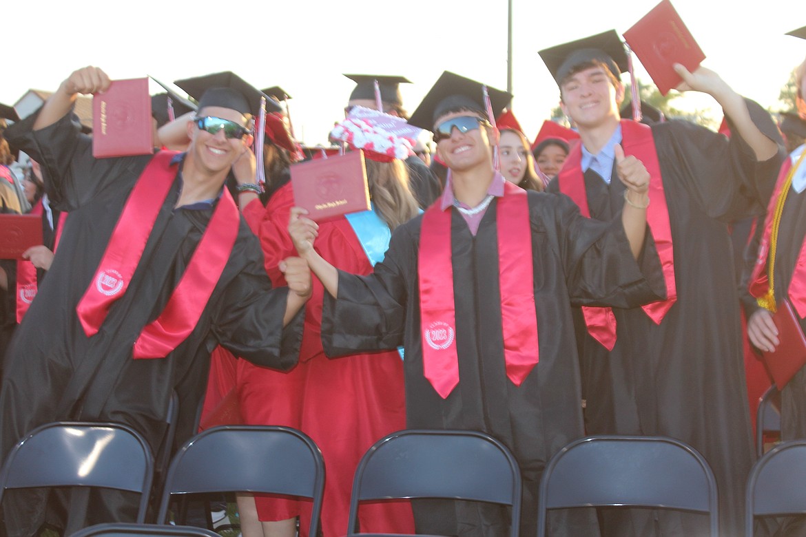 Proud members of the Othello High School class of 2023 show off their diplomas.