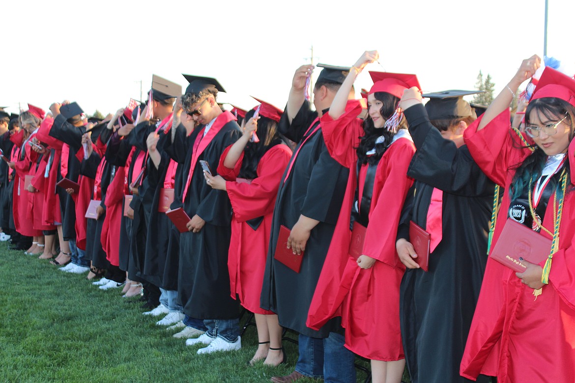 Othello seniors turn the tassel, signifying their high school days have come to an end.