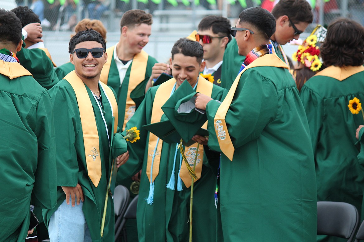 QUINCY — Quincy High School seniors are all smiles immediately following graduation ceremonies Saturday.