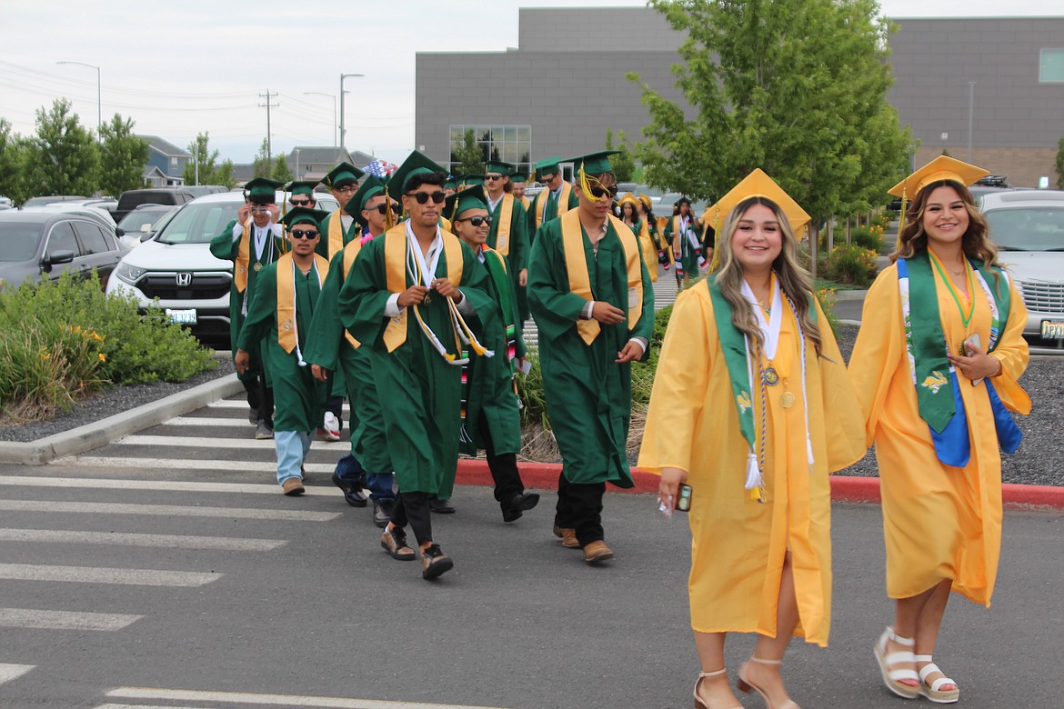 The Quincy High School class of 2023 walks to the stadium prior to graduation June 10.