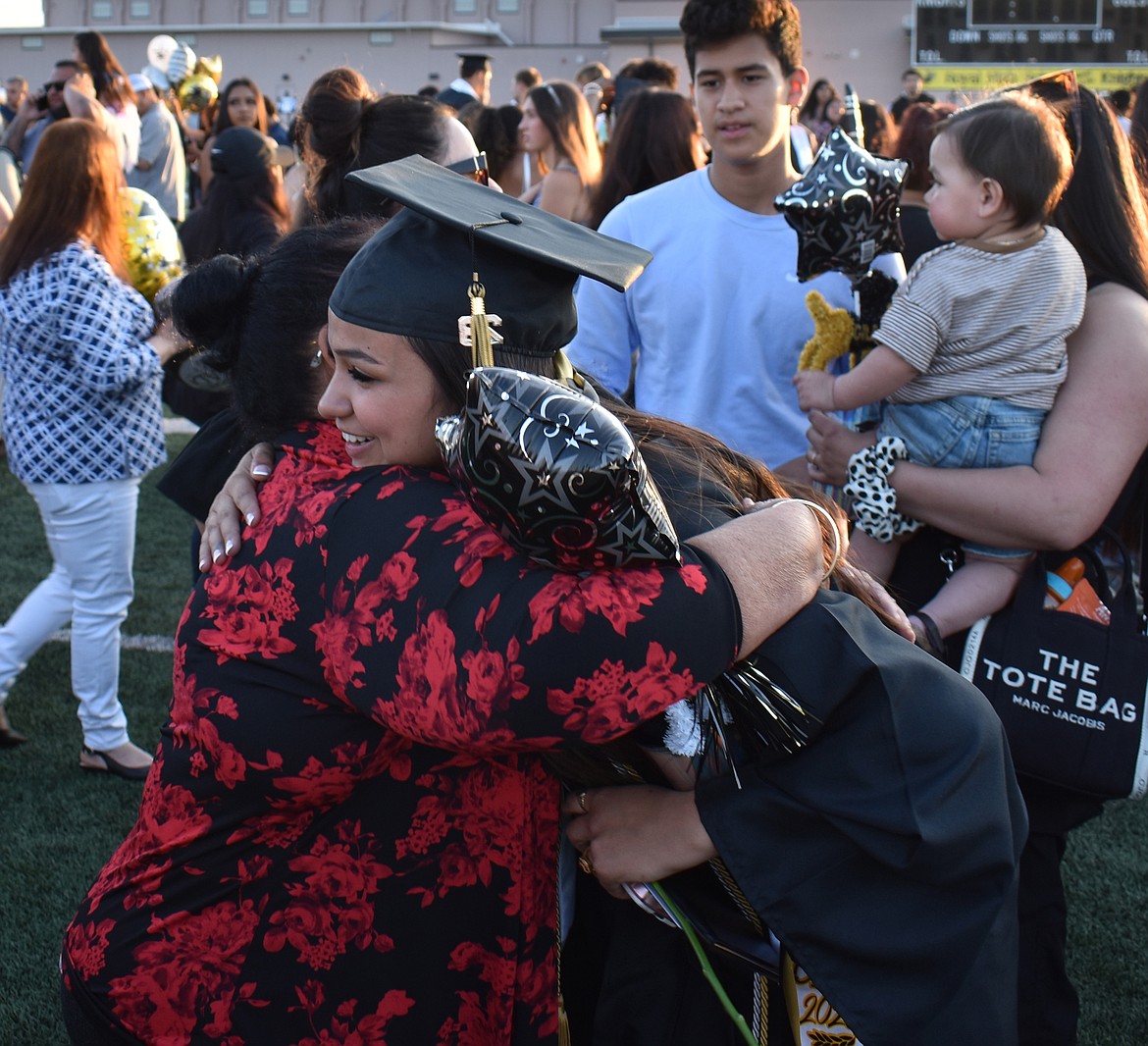 Newly-minted Royal High School graduate Maria Salas shares a hug with her grandmother Adela Briseño after the commencement ceremony June 2.