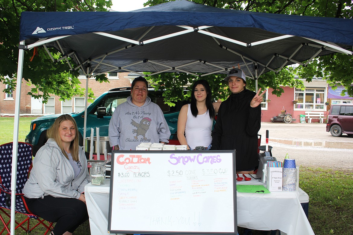 From left, Jessie Volore, Tina Swope, Eva Myers-Keating and Maryisa Swope had their first day of business Saturday at the opening of the Superior Farmers Market. Cotton candy and sno-cones are new items this year and will be available each and every Saturday though the season. (Monte Turner/Mineral Independent)