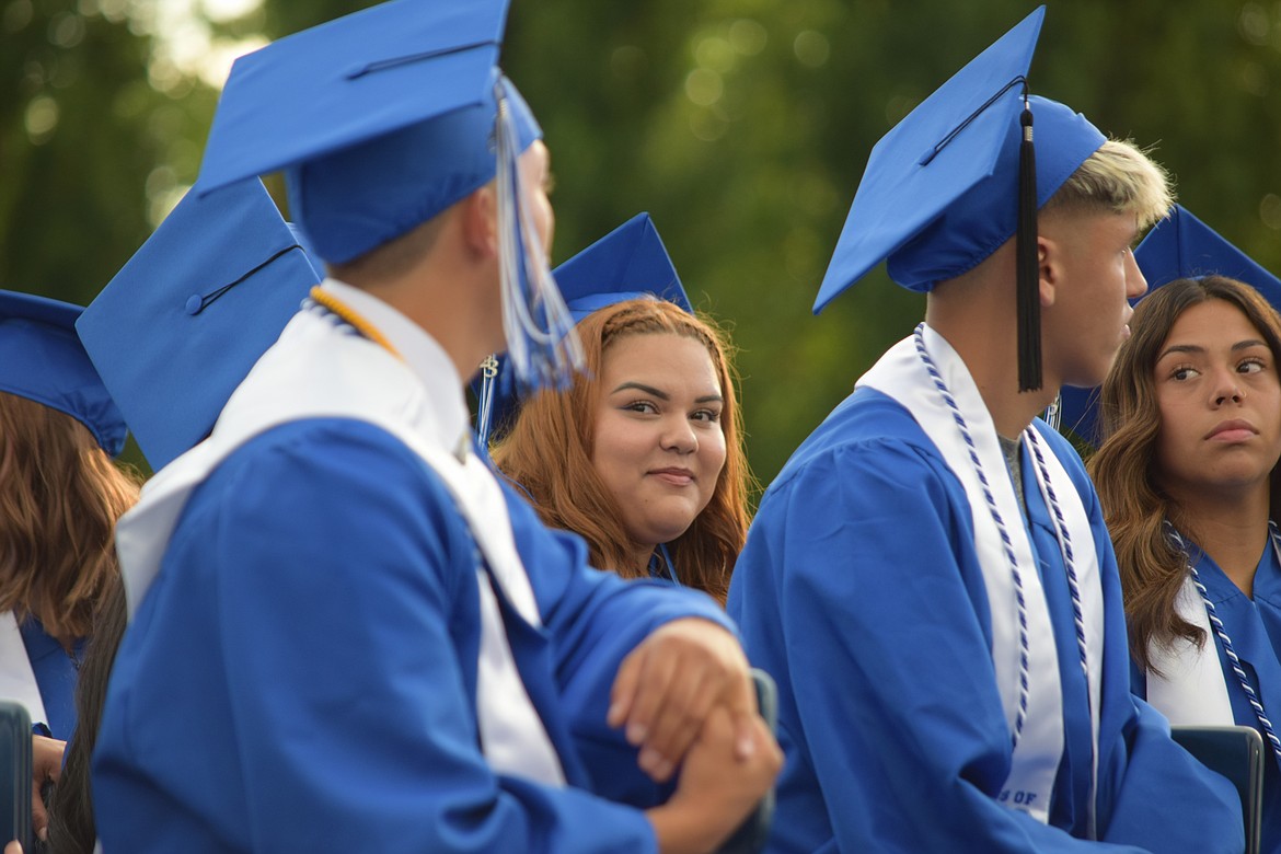 A member of the Warden High School class of 2023 views a slideshow of graduating seniors.