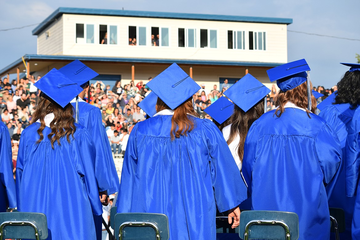 Warden high school students look out at a crowded stadium full of family members and friends at the start of the Warden High School class of 2023 graduation ceremony June 10.