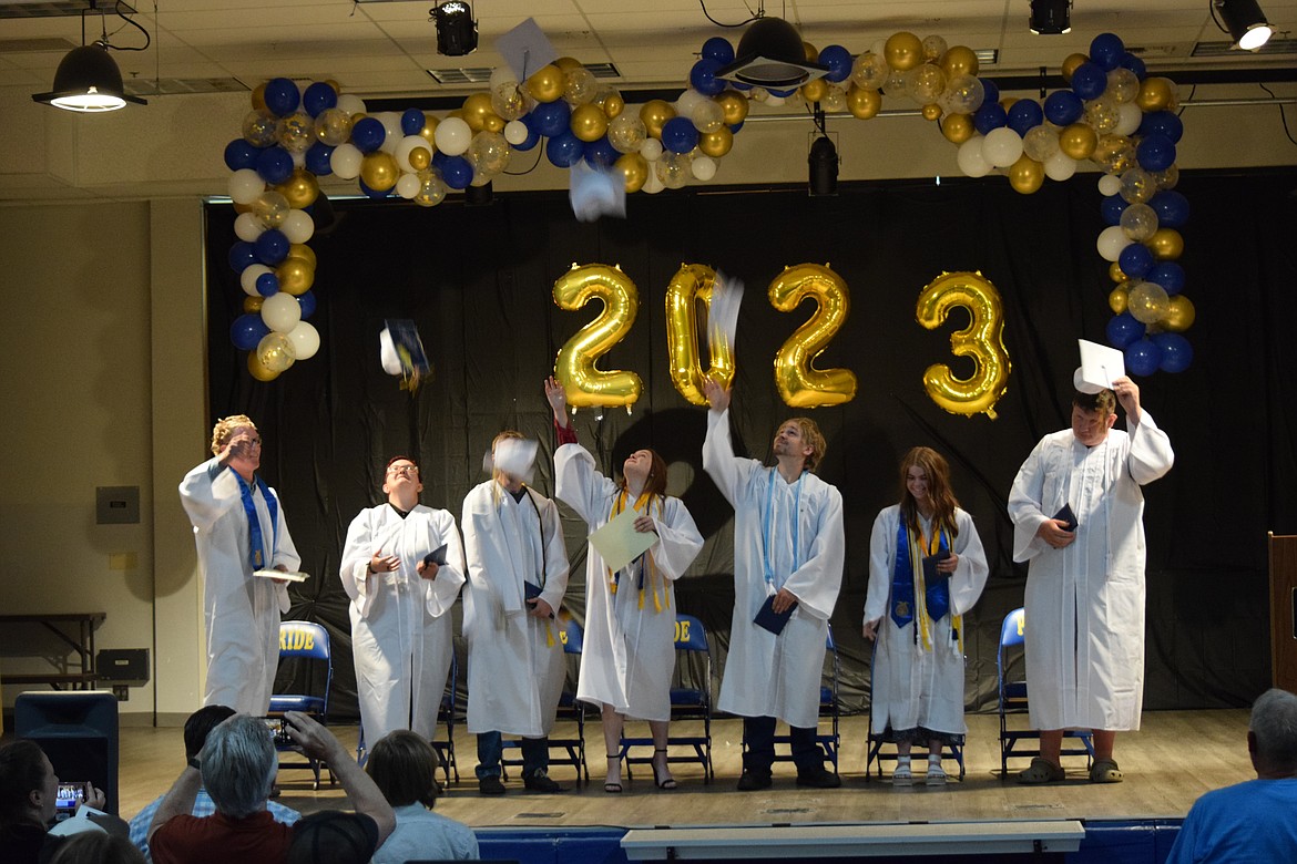 The Wilson Creek High School class of 2023 toss their graduation caps after receiving their diplomas and being fully certified as high school graduates.