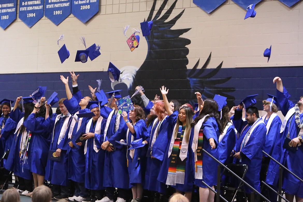 Soap Lake graduates toss their graduation caps into the air after turning the tassels at Saturday’s graduation.