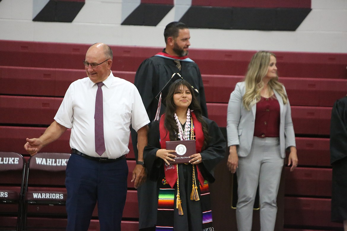 A Wahluke High School graduate smiles after receiving a diploma at the school’s graduation ceremony on June 2.