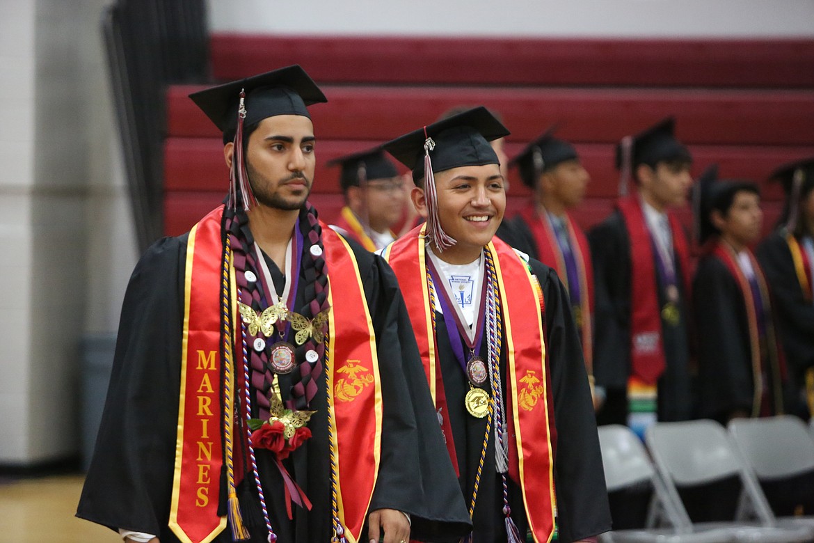 Soon-to-be graduates entered the Wahluke High School gymnasium in either pairs of two or trios to the tune of “Pomp and Circumstance” being played by the school’s band.