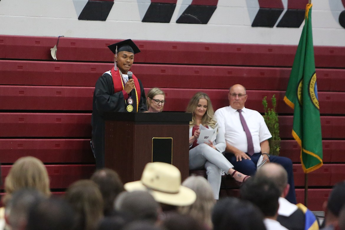 Wahluke Class President Juan Herrera, in black, speaks to the crowd during the school’s June 2 graduation ceremony,