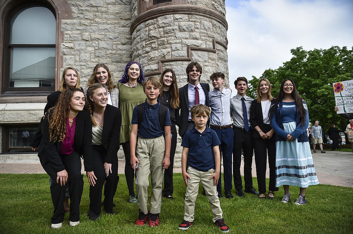 Youth plaintiffs in the climate change lawsuit, Held vs. Montana, pose outside the Lewis and Clark County Courthouse in Helena, Mont., on Monday, June 12, 2023. (Thom Bridge/Independent Record via AP)