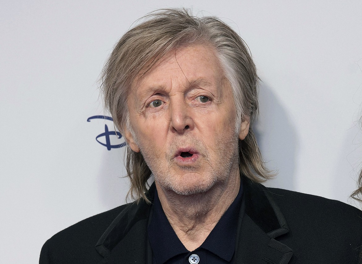 Paul McCartney and Nancy Shevell pose for photographers upon arrival for the premiere of the film 'If These Walls Could Sing' in London, Monday, Dec. 12, 2022. Artificial intelligence has been used to extract John Lennon's voice from an old demo to create “the last Beatles record,” Paul McCartney said Tuesday, June 13, 2023. McCartney, 80, told the BBC that the technology was used to separate the Beatles' voices from background sounds during the making of director Peter Jackson's 2021 documentary series, “The Beatles: Get Back." (Photo by Scott Garfitt/Invision/AP, File)