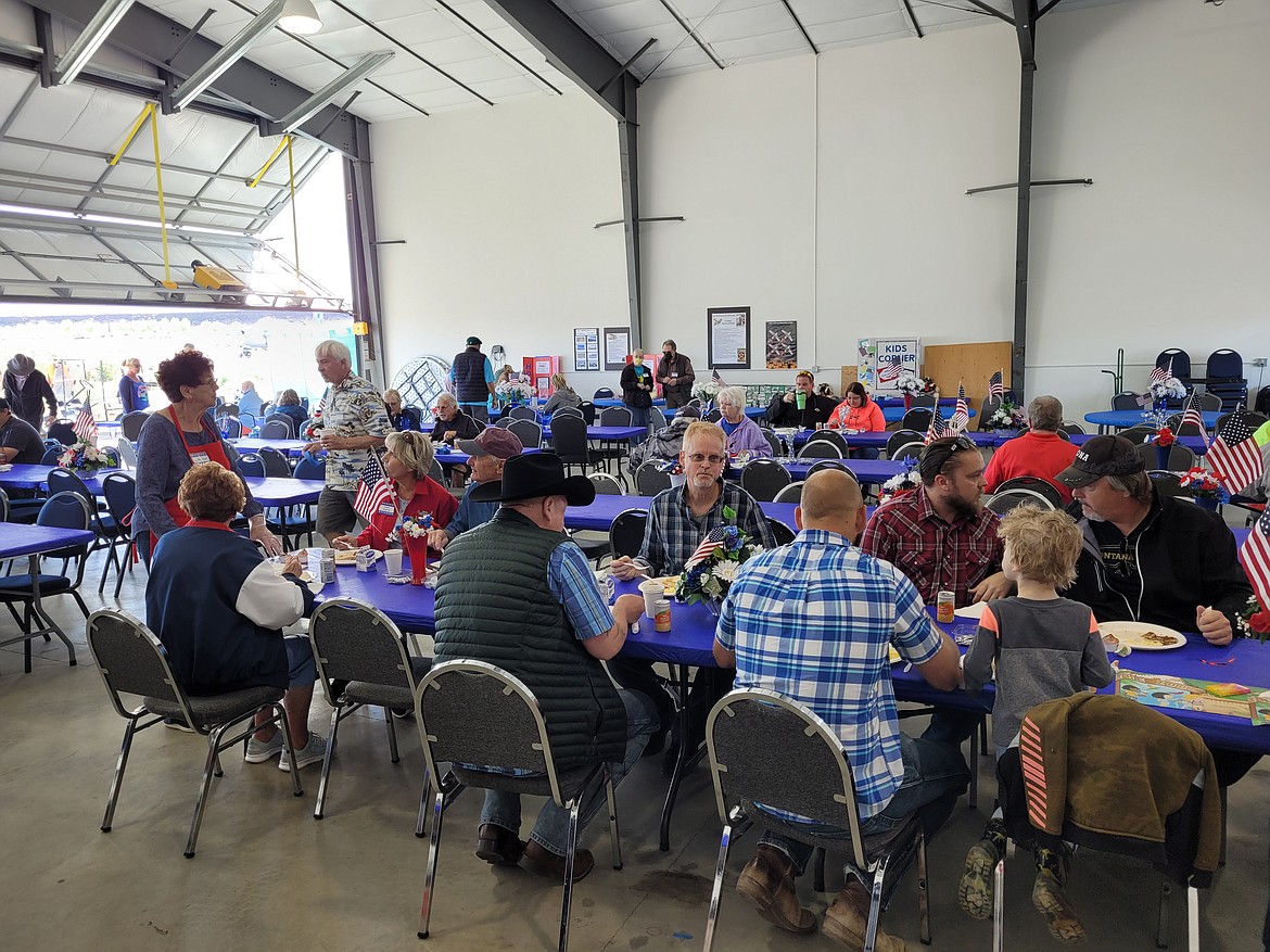 Pilots and local residents fill the hangar at the Desert Aire Airport for the 2022 Desert Aire Fly-In. The 2023 fly-in is scheduled for Saturday.