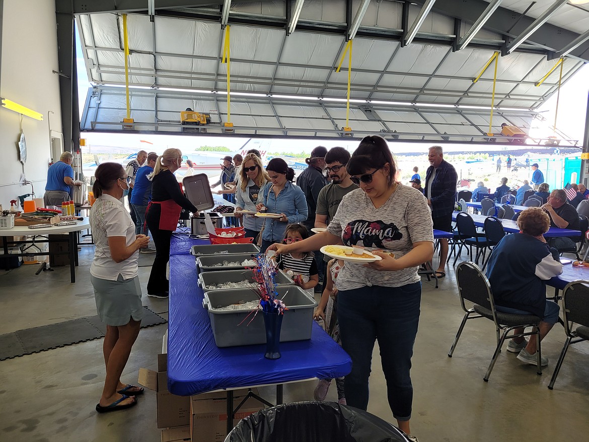 Participants line up for breakfast at the annual Desert Aire Fly-In 2022. Planes and pilots are scheduled to return for the 2023 fly-in Saturday.