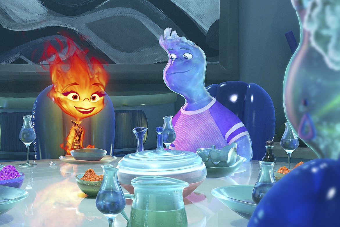 This image released by Disney/Pixar Studios shows Ember, voiced by Leah Lewis, left, and Wade, voiced by Mamoudou Athie in a scene from the animated film "Elemental."