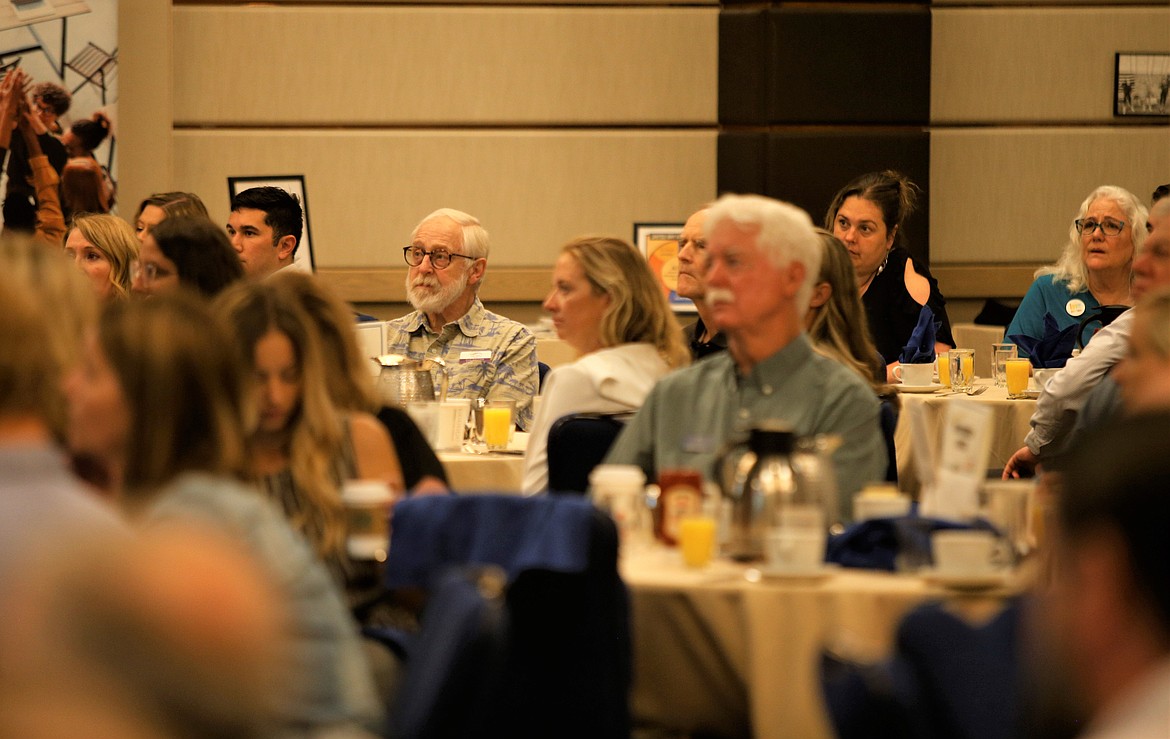 Attendees of the Coeur d'Alene Regional Chamber's Upbeat Breakfast listen to Greta Gissel, executive director of Connect Kootenai, at The Coeur d'Alene Resort on Tuesday.