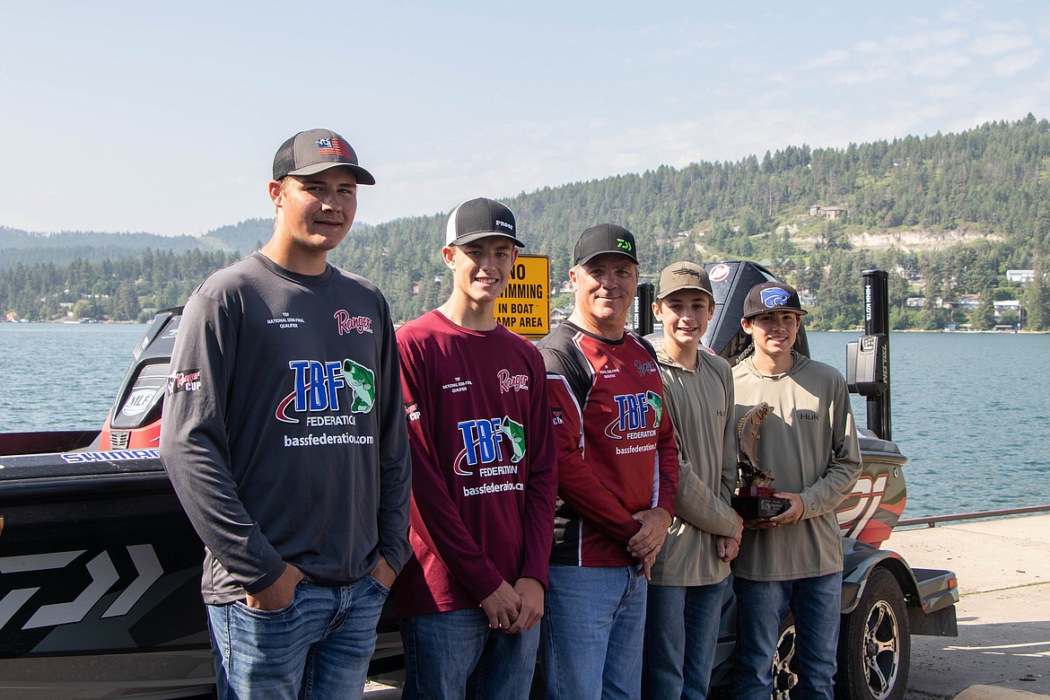 From left to right Aiden Curriz, Silas Jones, Randy Siemens Christian Rensel and Drake Dawson pose for a portrait at the Somers boat launch on June 13, 2023. (Kate Heston/Daily Inter Lake)