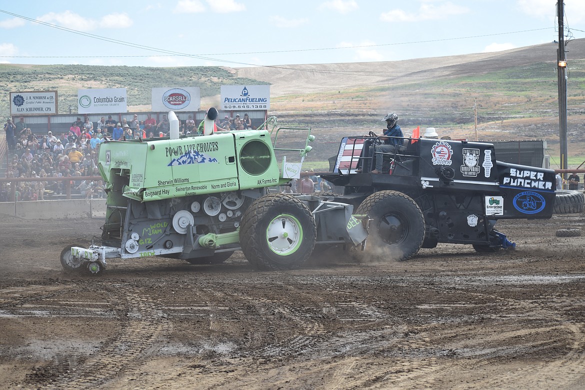 Two combines, dubbed Super Puncher and Pour Life Choices, collide in the arena at the Lind Combine Derby Saturday.