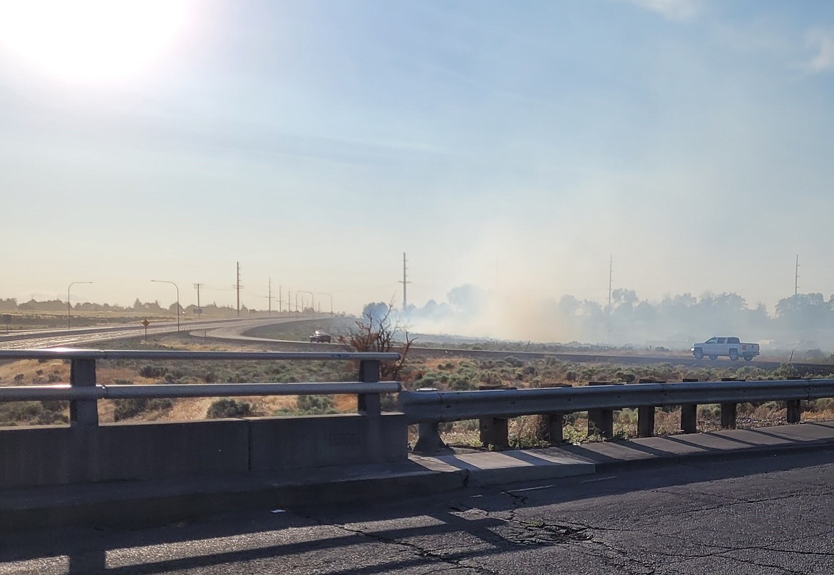 A fire broke out in Moses Lake shortly before 7 p.m. Tuesday and Moses Lake Fire responded to get it under control. Here, the fire is seen from the overpass bridge at the intersection of Stratford Road and State Route 17.